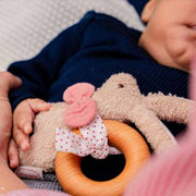Baby holding Kathe Kruse natural wooden ring and soft rabbit teether grasper toy from Wooden Playroom in Australia