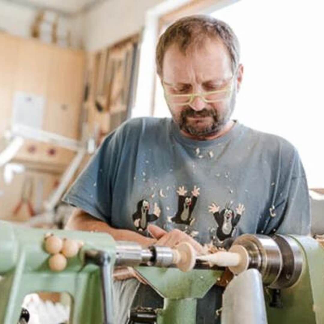 Klaus Mader creating spinning tops in his workshop - Behind the Scenes at Mader