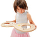 Girl concentrating and using the Erzi 45409 Erzi Wooden Lazy Eight Board for tracking the Figure 8 for adults and children