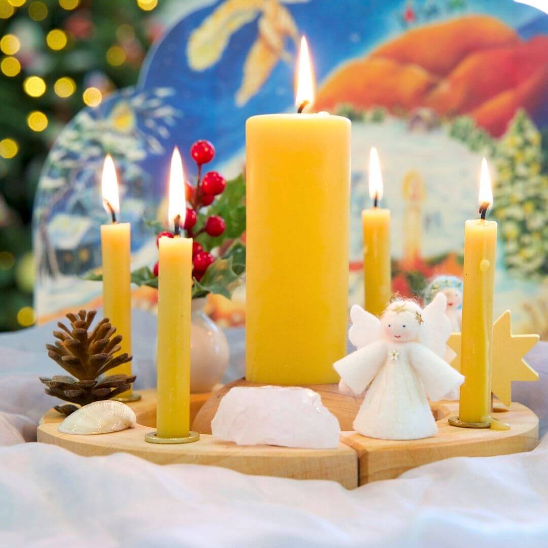 A Christmas celebration ring with Dipam beeswax candles and festive decorations