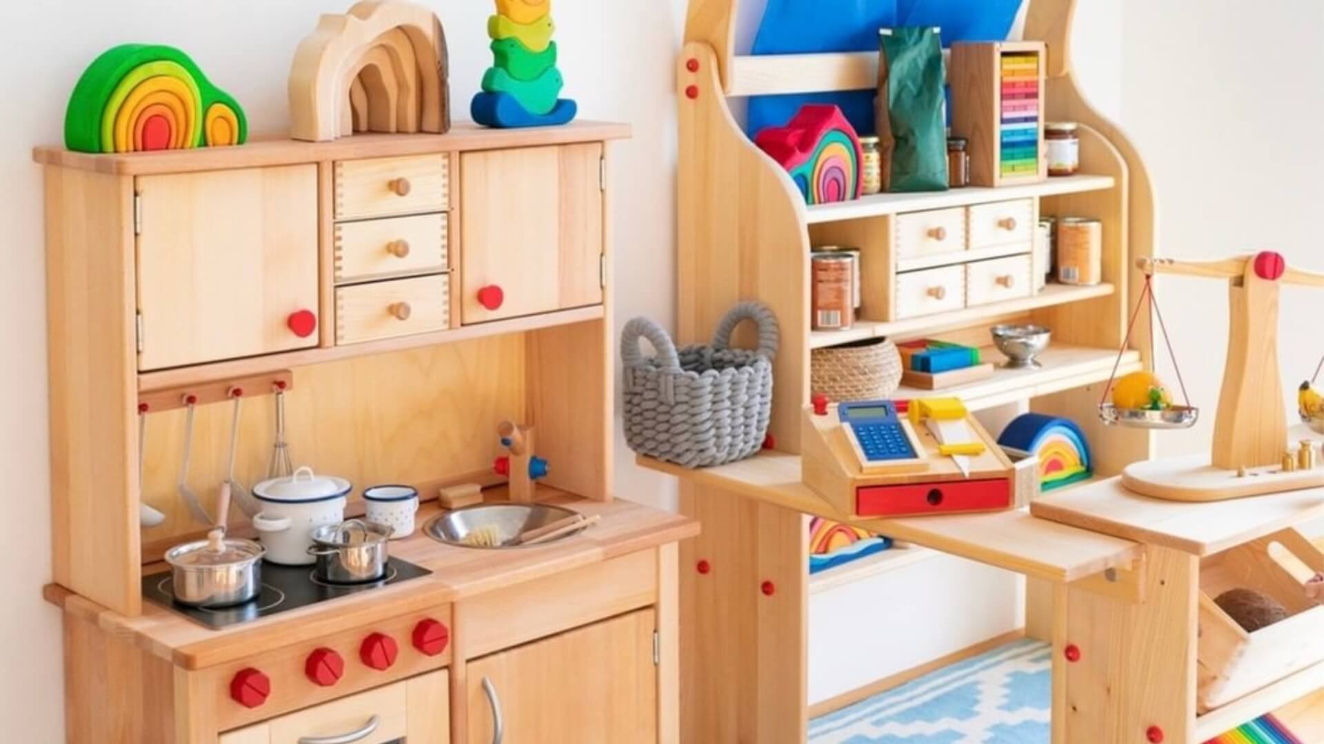 Children's Gluckskafer play kitchen set with various toys and furniture.